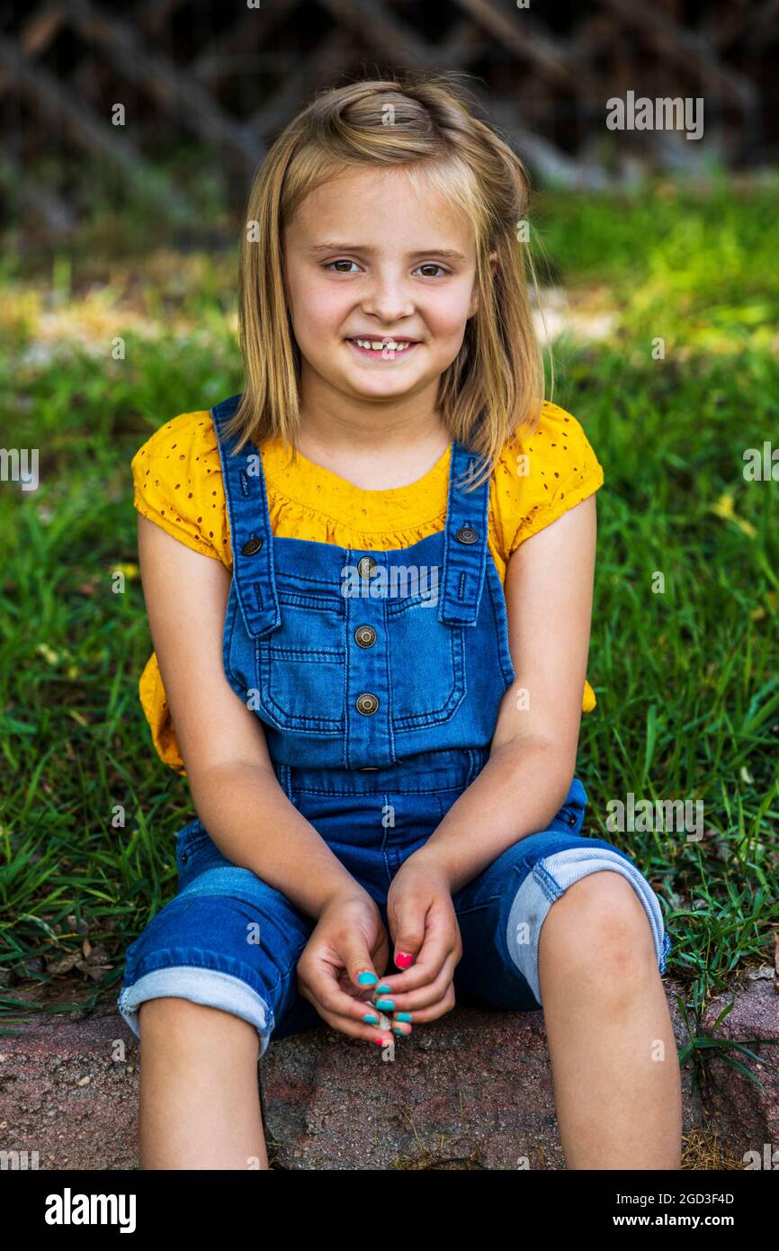 Outdoor candid portrait of cute young girl on a summer day Stock Photo