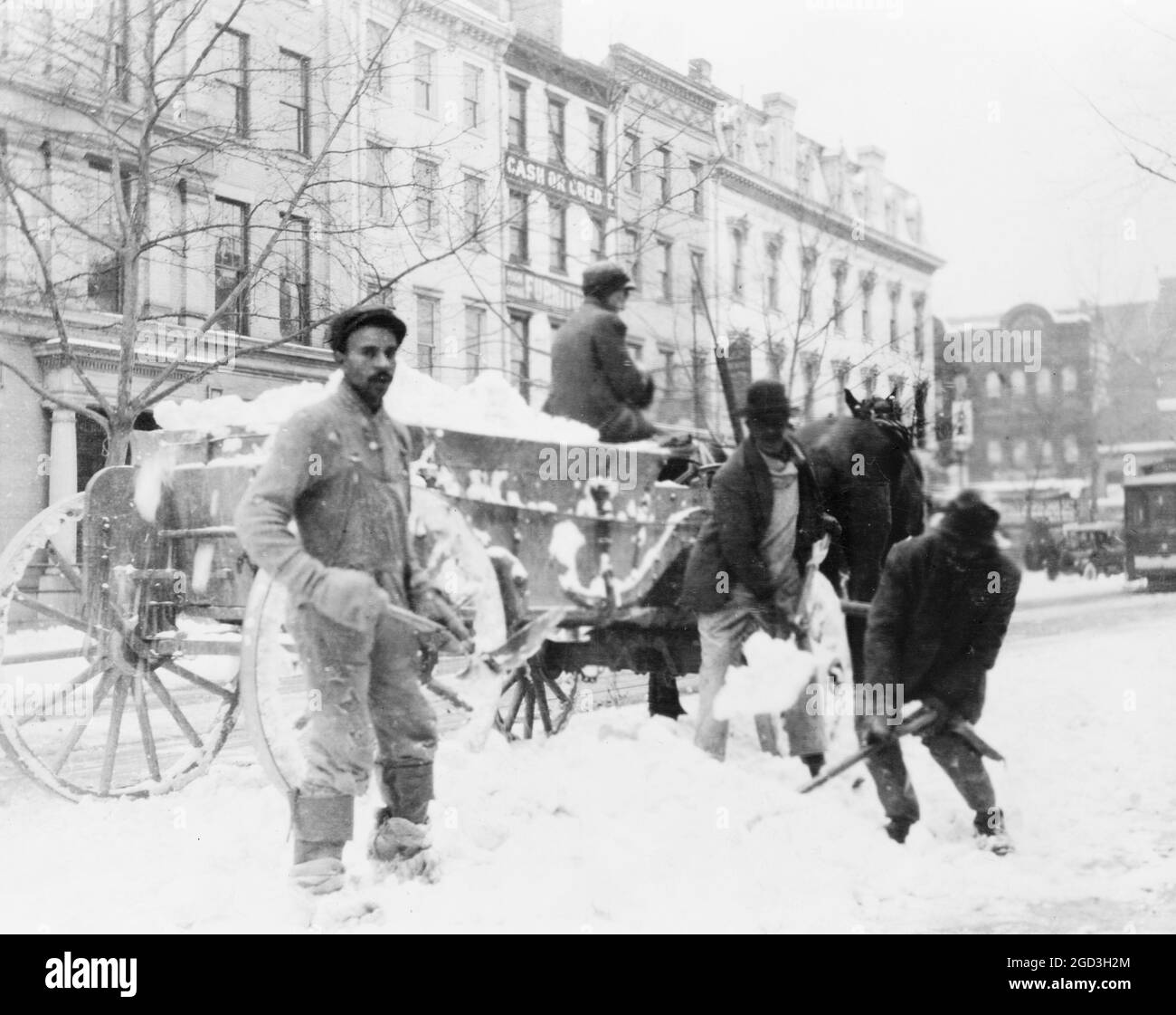 Men loading snow onto wagon, after snow storm, in Washington, D.C. ca. [between 1909 and 1920] Stock Photo