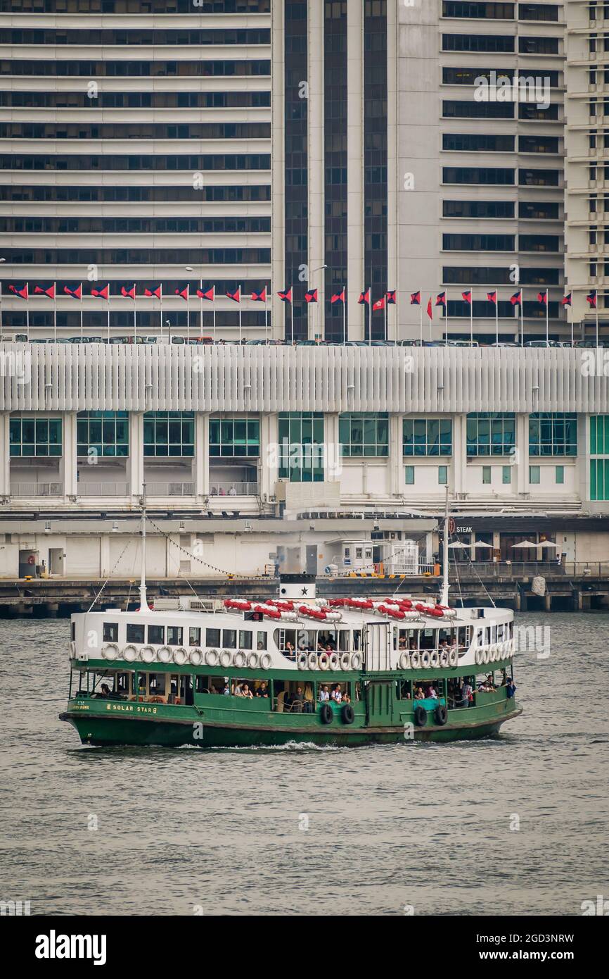 The 'Solar Star', one of the Star Ferry fleet, crosses Victoria Harbour from Tsim Sha Tsui to Central Ferry Pier 7 on Hong Kong Island Stock Photo