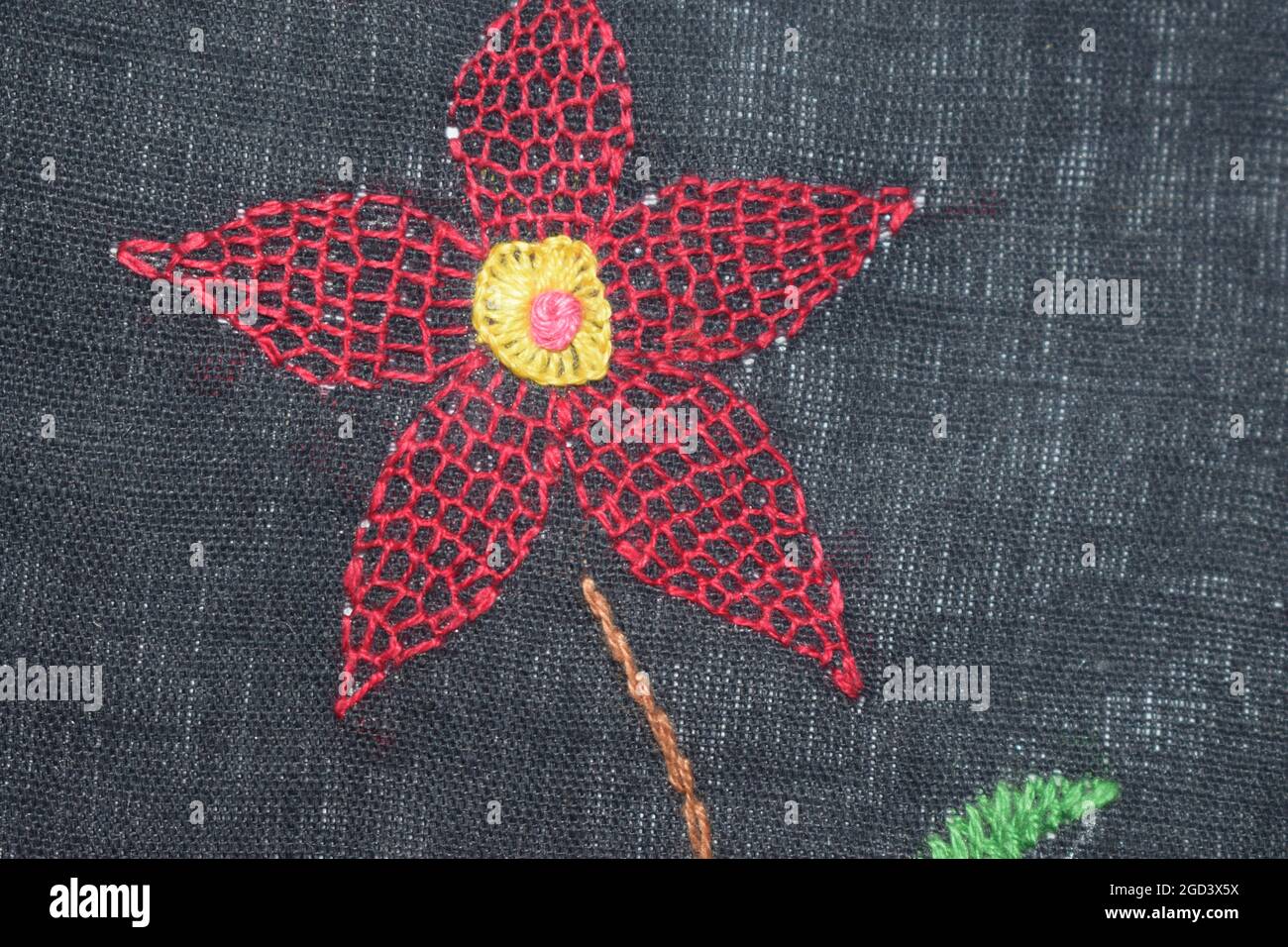 Honeycomb flower stitch design with little blanket stitch midpoint in hand  embroidery Stock Photo - Alamy