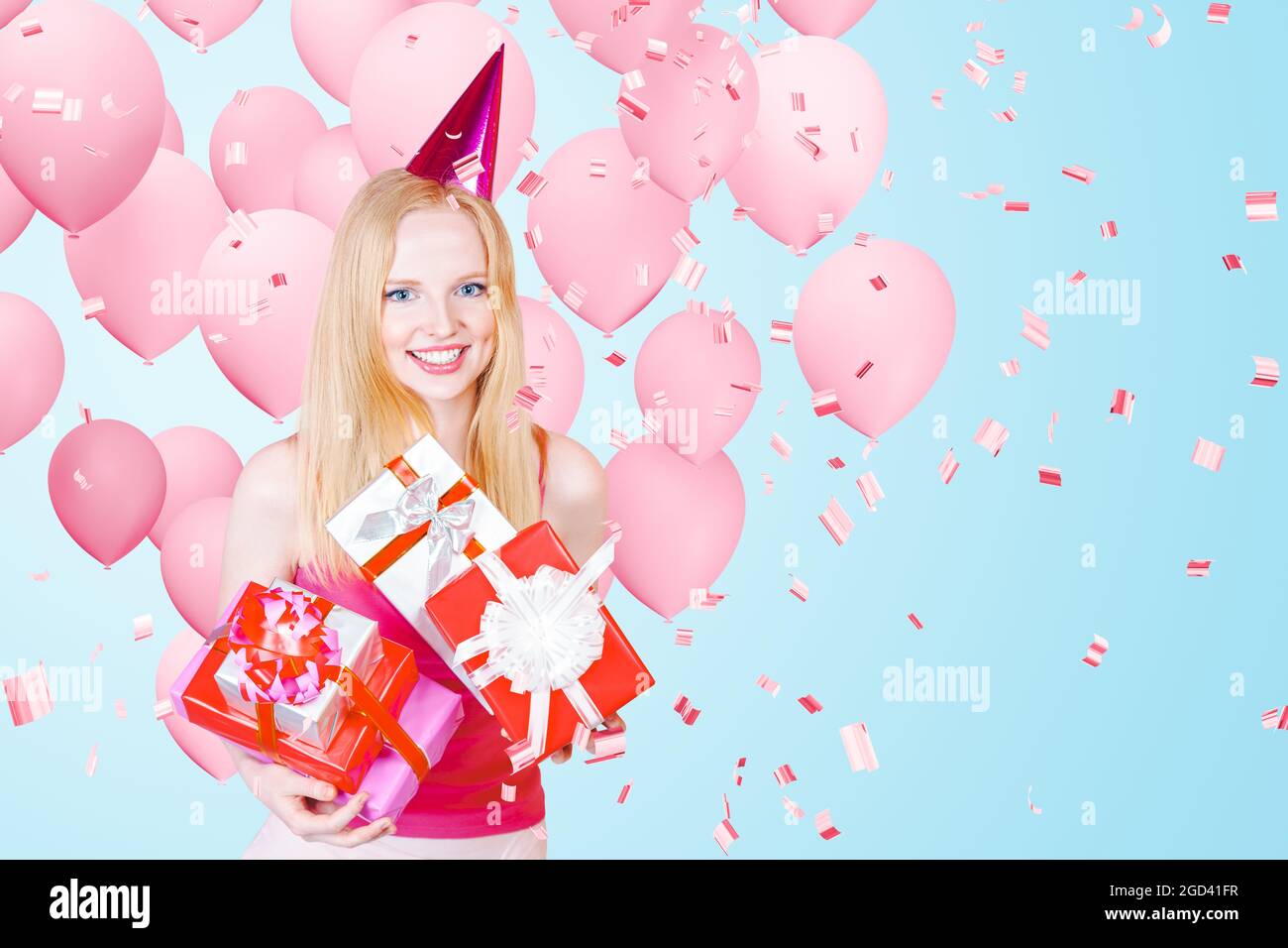 Beautiful Happy Young woman on birthday holiday party with pink air balloons. Stock Photo