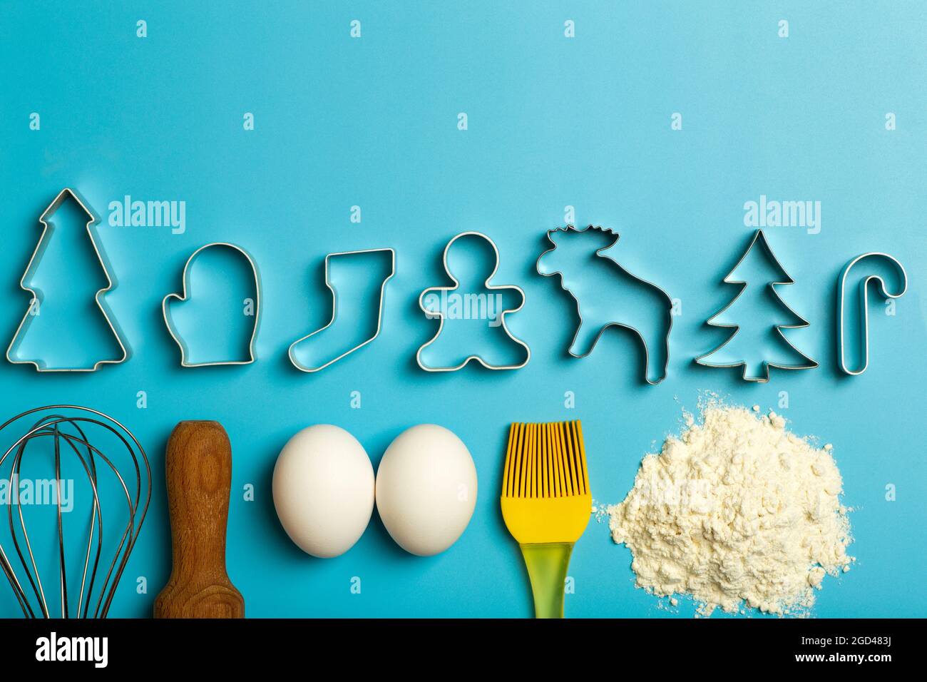 Christmas baking background. Christmas cookie cutters molds on the kitchen  baking table. Festive food and New Year's mood. High quality photo Stock  Photo - Alamy