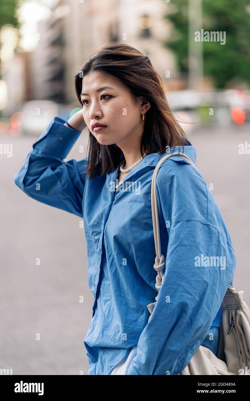 Confident asian woman posing hi-res stock photography and images - Alamy