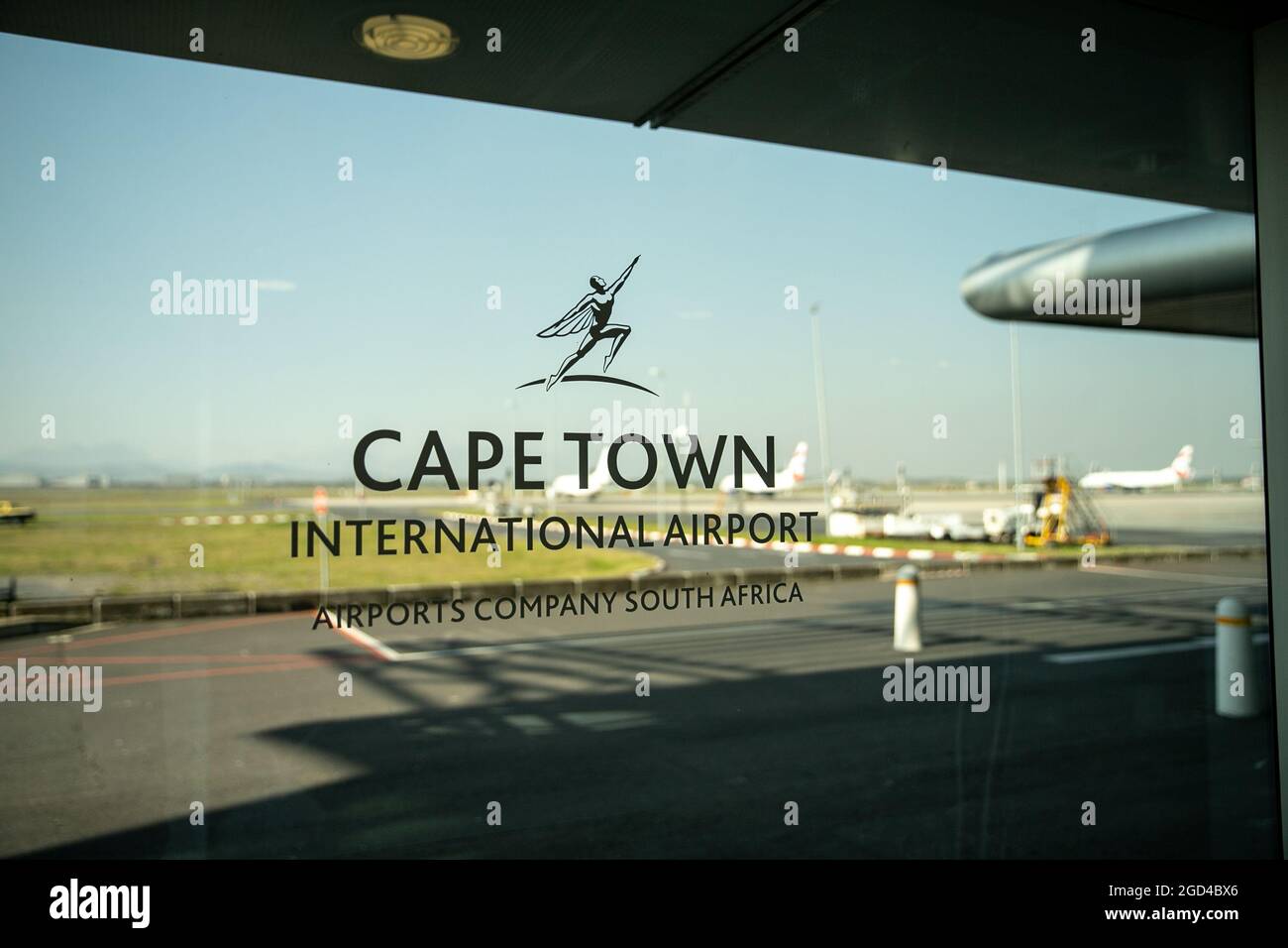 Cape Town, South Africa. 6th Aug, 2021. The logo of Cape Town International Airport is pictured on a window at Cape Town International Airport, South Africa, Aug. 6, 2021. Cape Town International Airport has won the 2021 Best Airport in Africa Award for the sixth consecutive year at the annual Skytrax World Airport Awards, the airport said Tuesday. Credit: Lyu Tianran/Xinhua/Alamy Live News Stock Photo