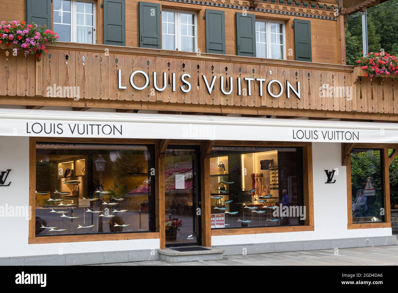 As Non-Essential Businesses Close In Switzerland, Lines Form Outside Of Louis  Vuitton In Gstaad