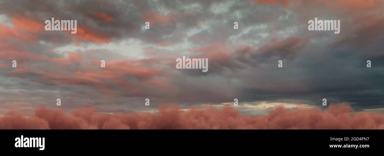 panoramic view to red evening sky with fluffy clouds Stock Photo