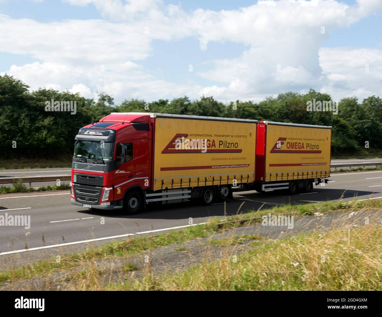 An Omega Pilzno lorry on the M40 motorway, Warwickshire, England, UK Stock Photo