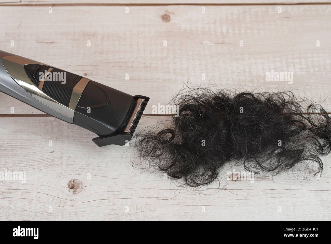 Cordless hair trimmer. During the pandemic when barbershops are closed, more men bought the devise to cut their own hair. Selective focus points. Blur Stock Photo