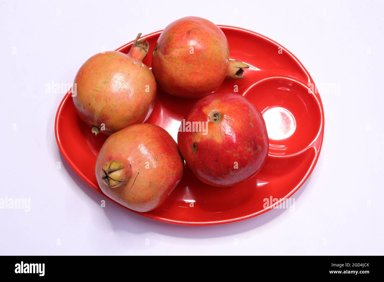 Fresh Pomegranate Fruits Isolated on White Background Stock Photo
