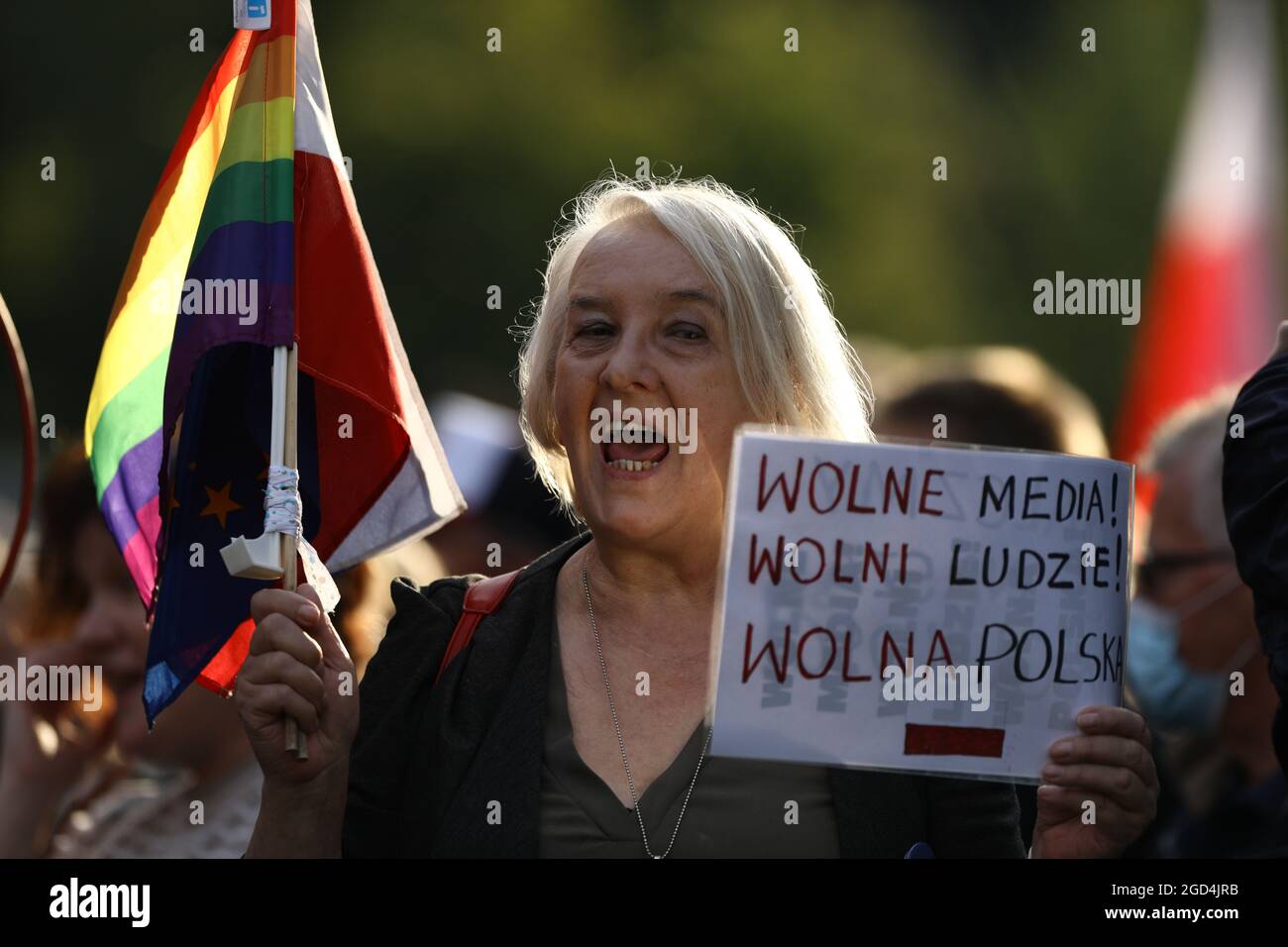 A woman is seen during holding a sign with the words 'Free media, free people, free Poland' in Warsaw, Poland on August 10, 2021. Over a thousand peop Stock Photo