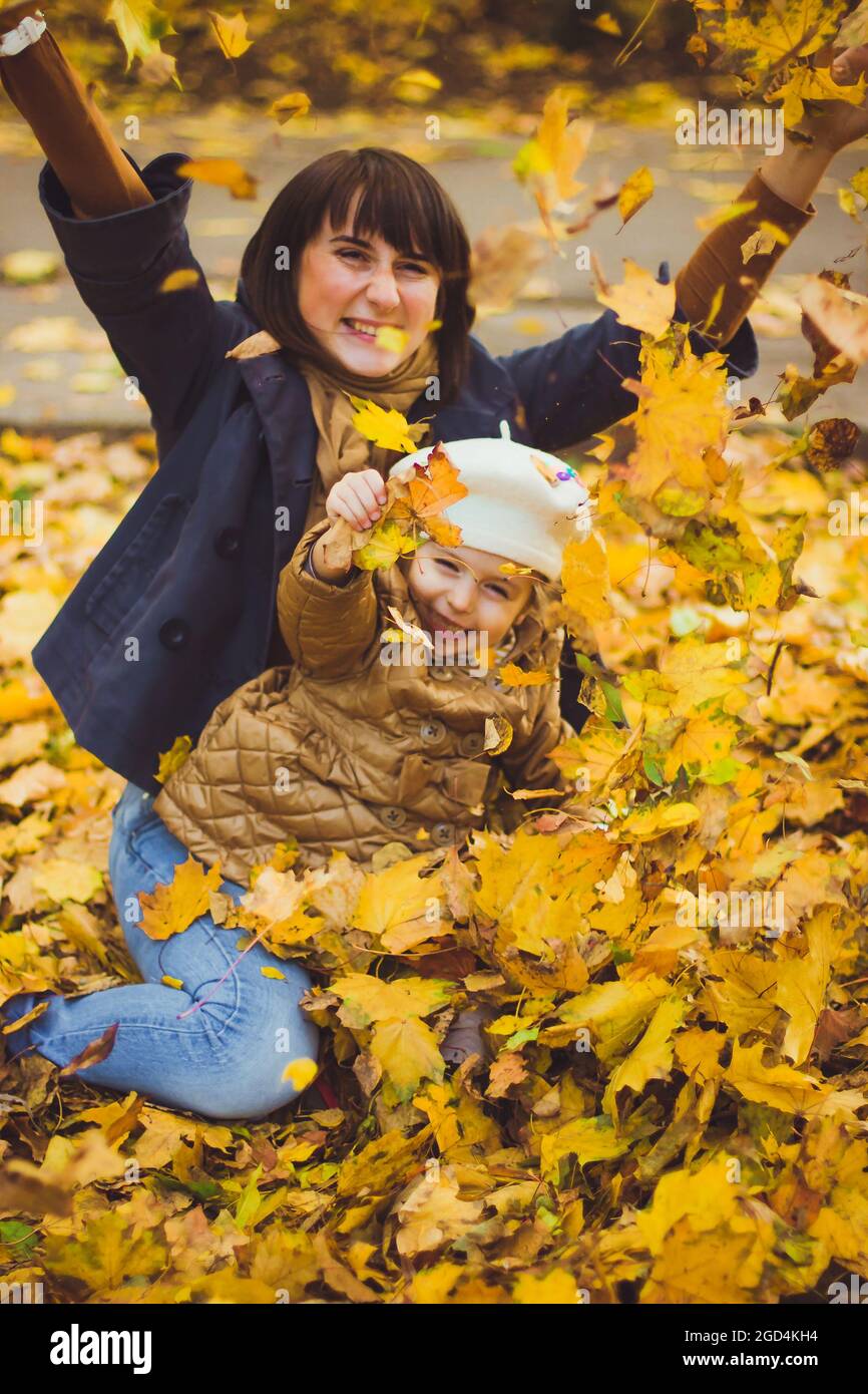 Young mother and her daughter have fun at autumn Stock Photo - Alamy