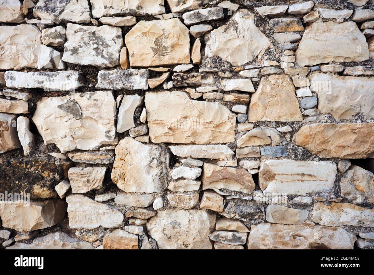 Aged stone wall texture background. Stock Photo