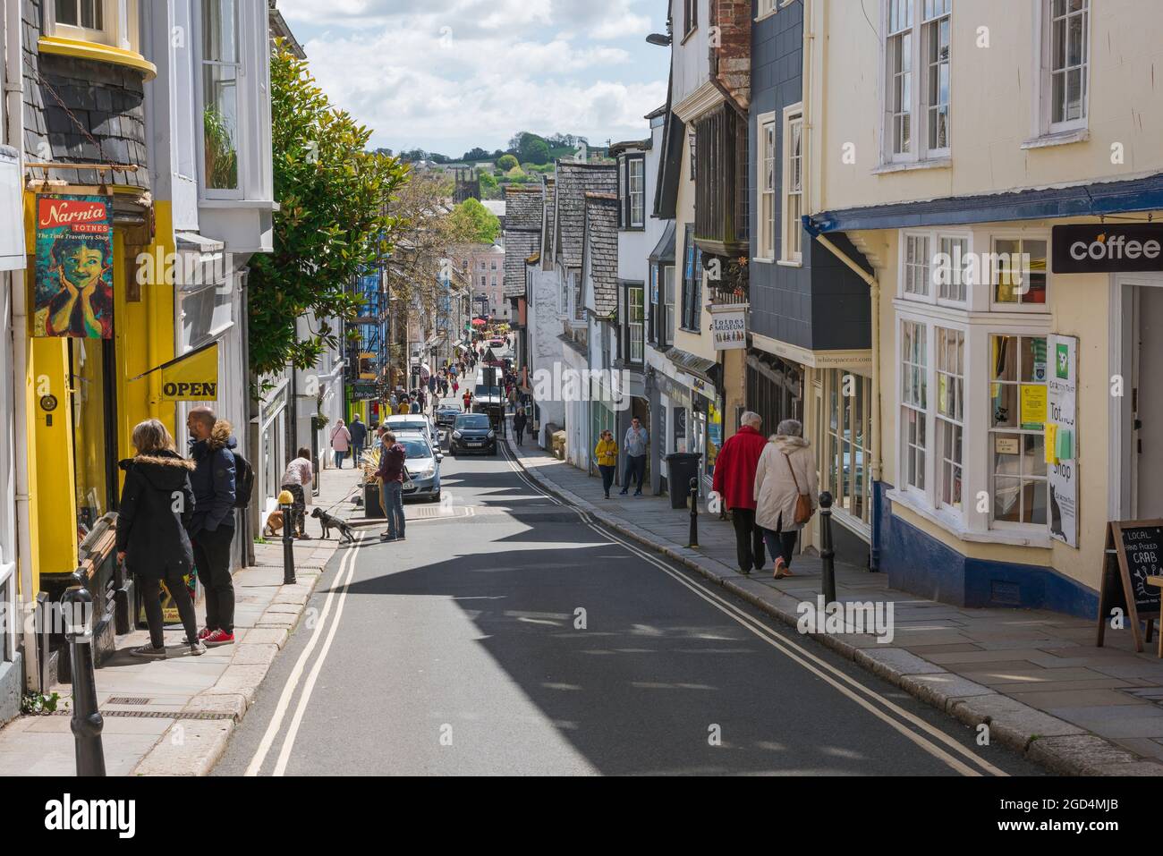 UK high street, view of traditional shops in the main shopping street (Fore Street) in Totnes, Devon, England, UK Stock Photo