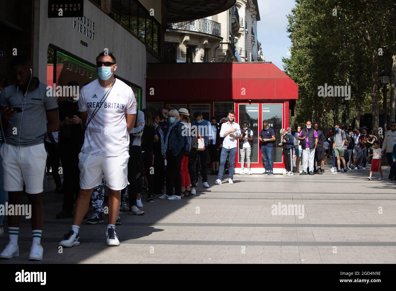 Paris, France. 11th Aug, 2021. People queue to buy a jersey of PSG's Argentinian football player Lionel Messi at the Paris-Saint-Germain (PSG) football club store on the Champs Elysees avenue in Paris on August 11, 2021. Messi signed on August 10, 2021 a two-year deal with PSG with the option of an additional year. The 34-year-old will wear the number 30 in Paris, the number he had when he began his professional career at Barca. Photo by Raphael Lafargue/ABACAPRESS.COM Credit: Abaca Press/Alamy Live News Stock Photo