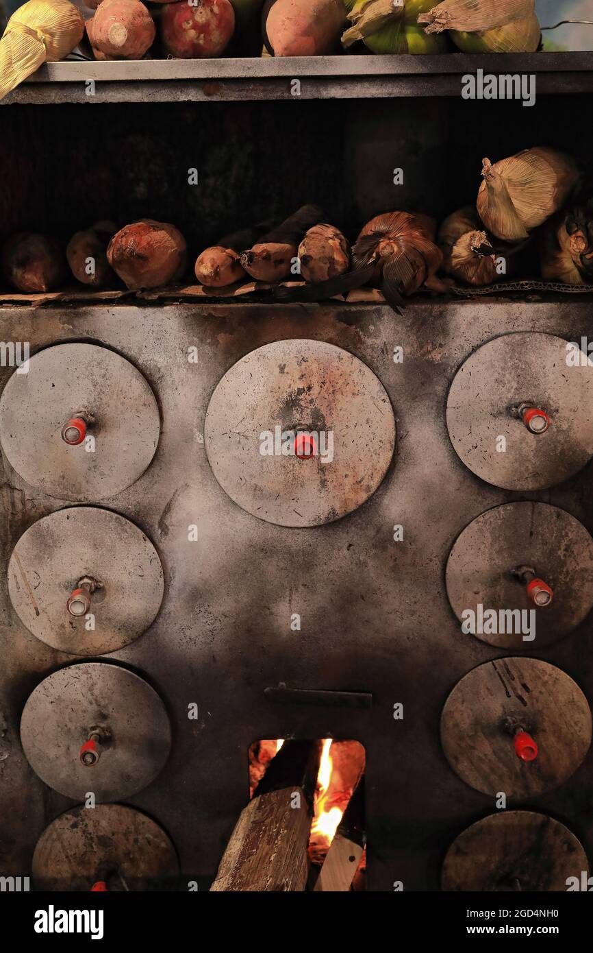 Wood burning ovenkitchen stovebaking sweet potatoes roasting corncobs. Muslim QuarterXi'an Wood burning ovenkitchen stovebaking sweet potatoes roasting corncobs. Muslim QuarterXi'an