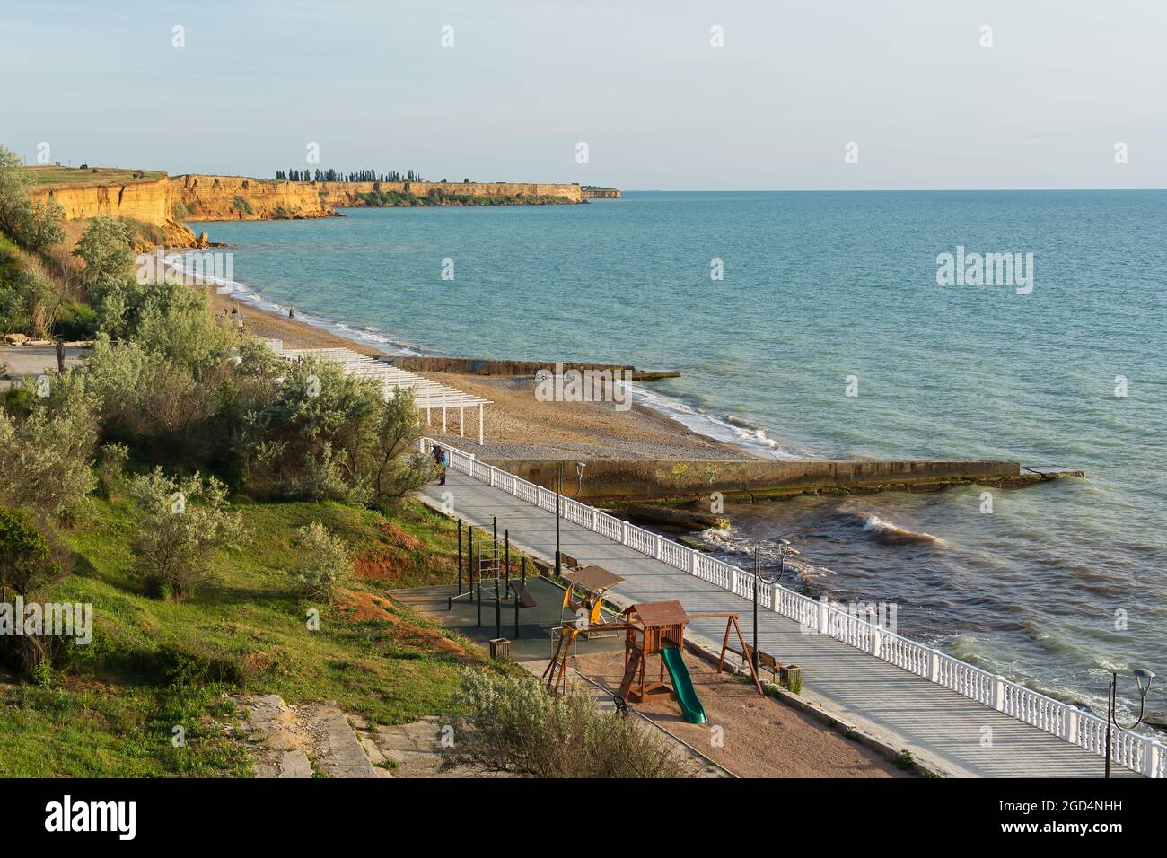 Crimea, the Village of Andreevka on May 23, 2021. A beach with breakwaters, ennobled with a Playground without people. A deserted view outside the swi Stock Photo