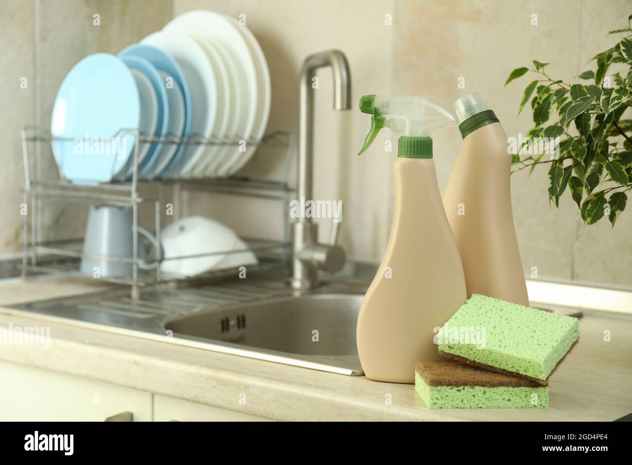 Concept of Dishwashing detergent accessories on kitchen background Stock  Photo - Alamy