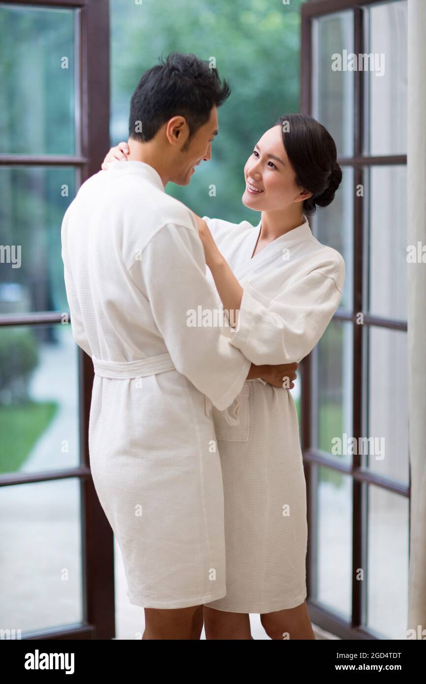 Loving couple in bathrobes embracing in a luxury hotel Stock Photo Alamy