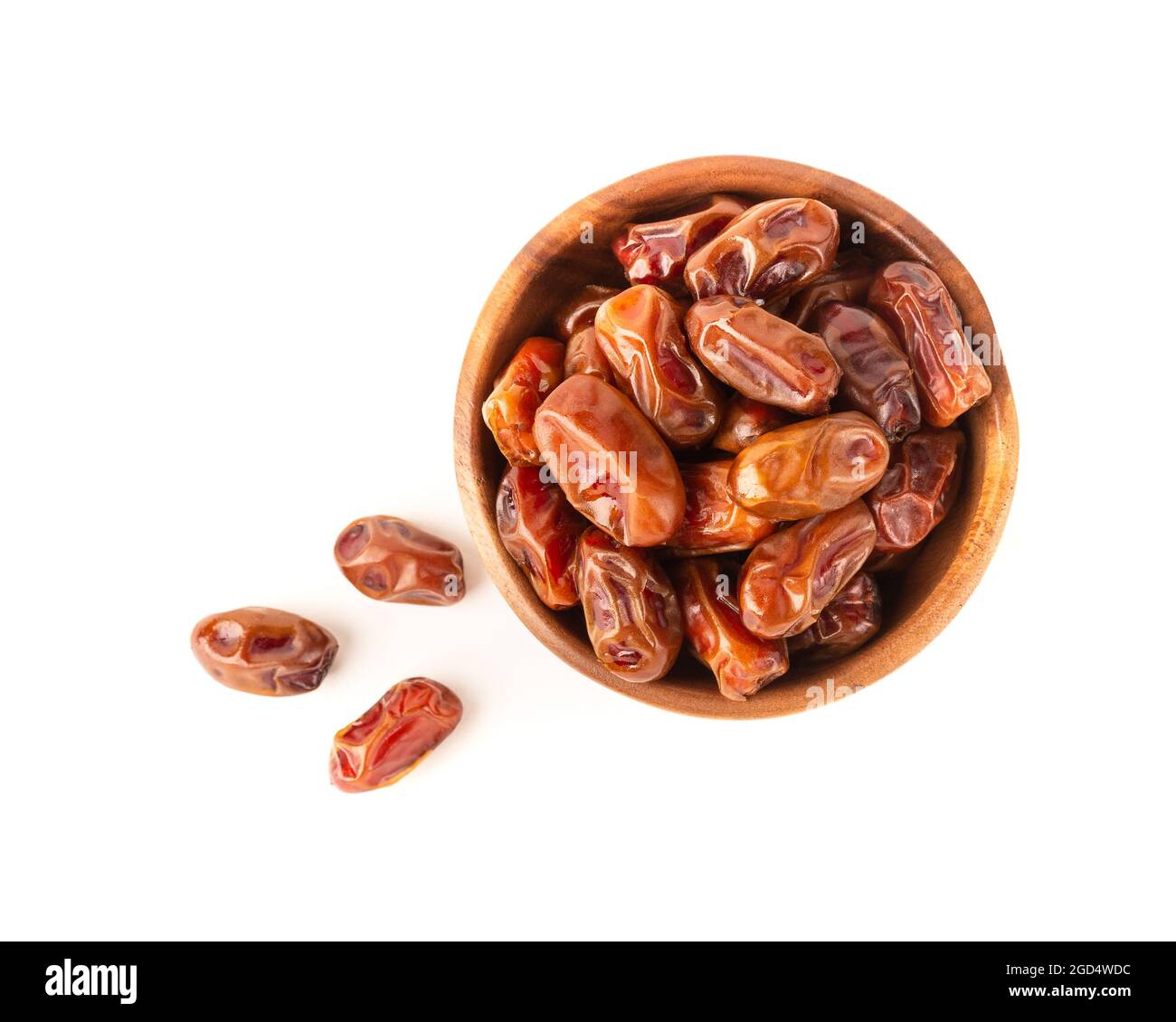 Dried dates in wooden bowl isolated on white background. Top view Stock ...