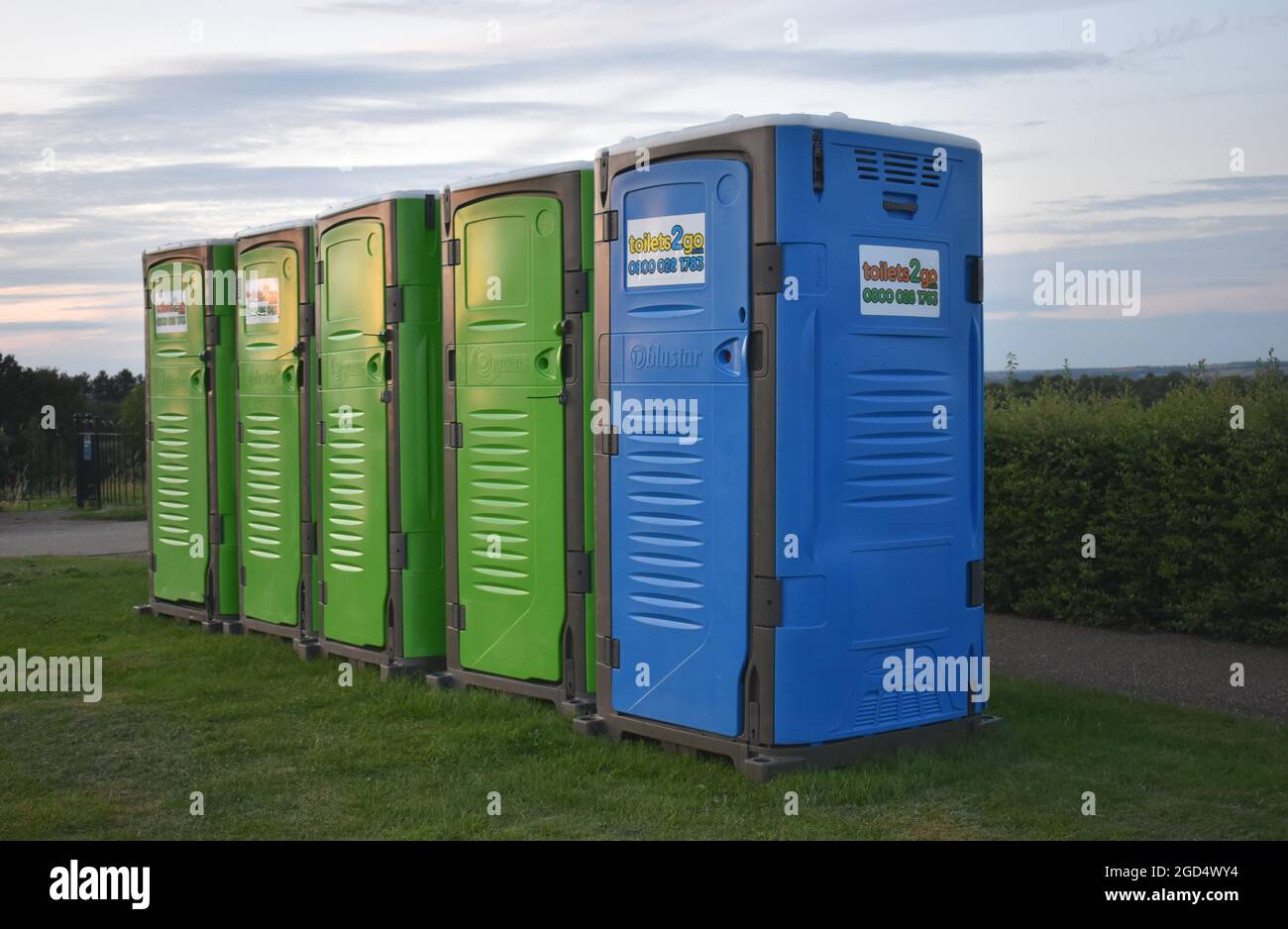 Colourful mobile toilets for a festival in Campbell Park in Milton Keynes. Stock Photo