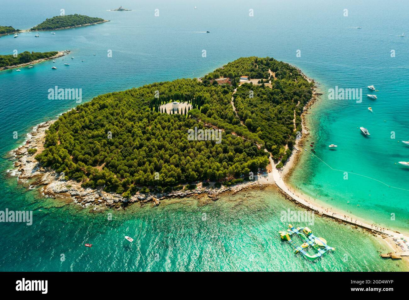 Red island near by Rovinj city in Croatia. Croatian name is Otocic Maskin. It has a hotel, aquapark, chruch monument and amazing beaches Stock Photo