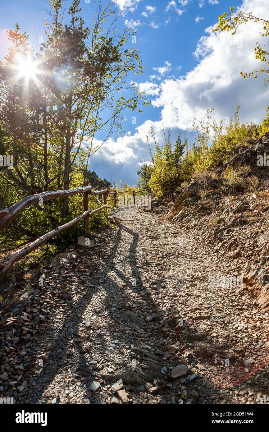 Hiking Path in cloudy sunny day Stock Photo