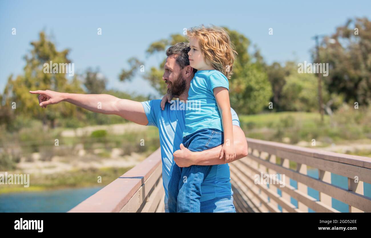 family value. childhood and parenthood. parent point finger showing something child boy. Stock Photo