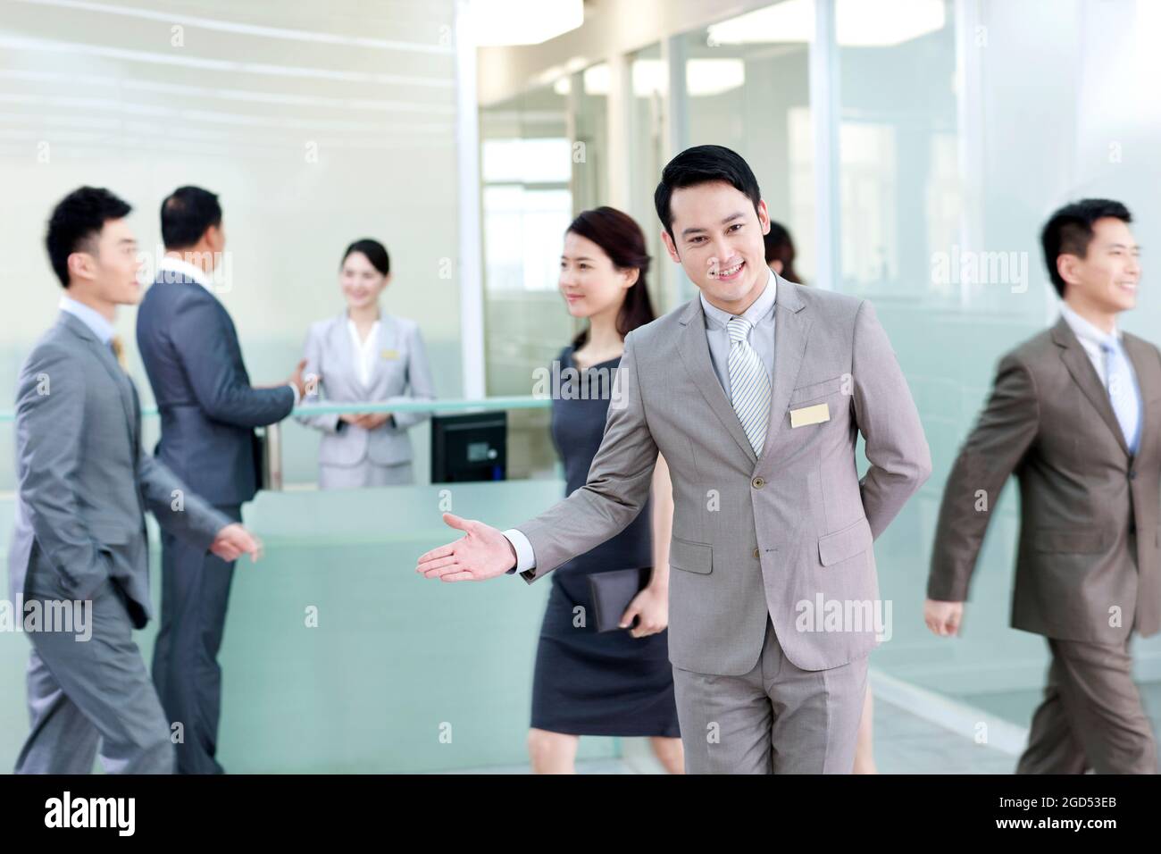 Business persons at front desk Stock Photo Alamy