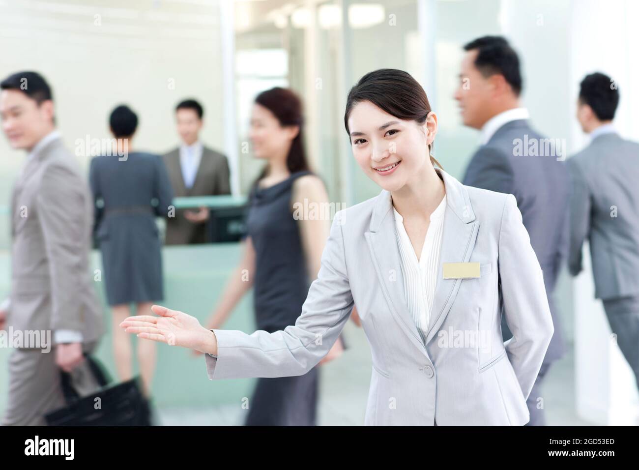 Business persons at front desk Stock Photo Alamy
