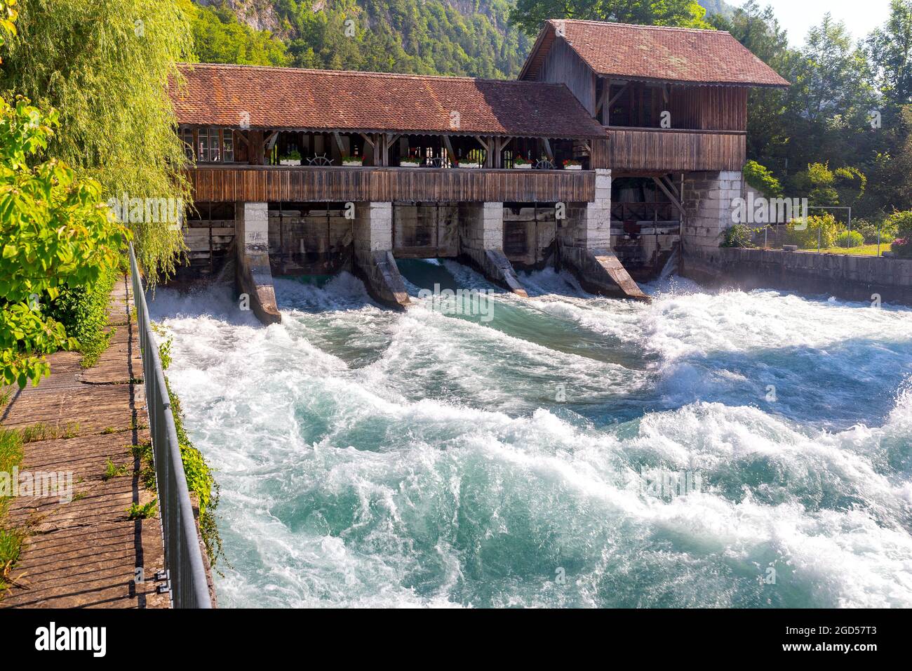 View of the old medieval wooden dam and the mill on the river Aare.  Interlaken. Switzerland Stock Photo - Alamy
