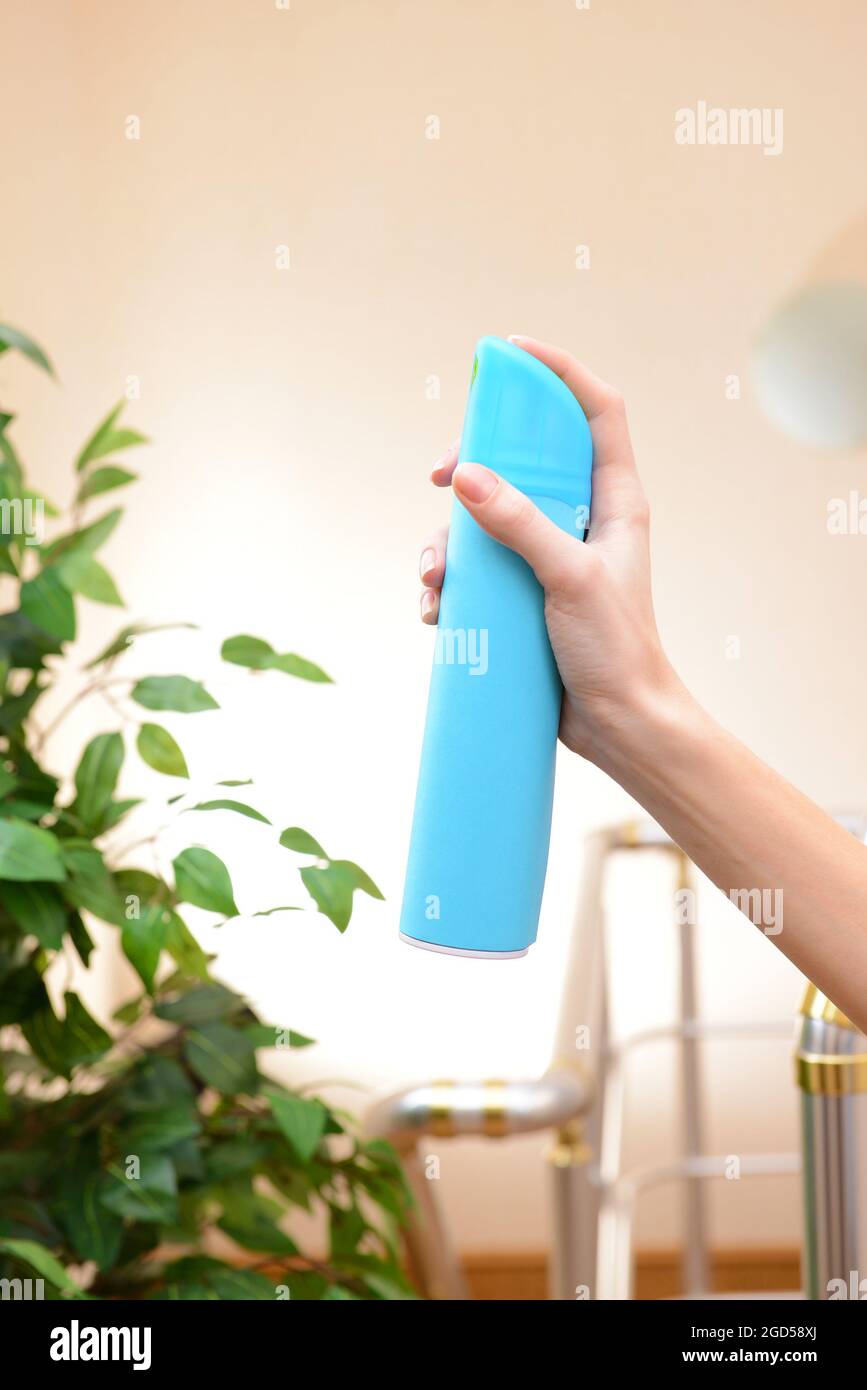 Sprayed air freshener in hand closeup Stock Photo Alamy