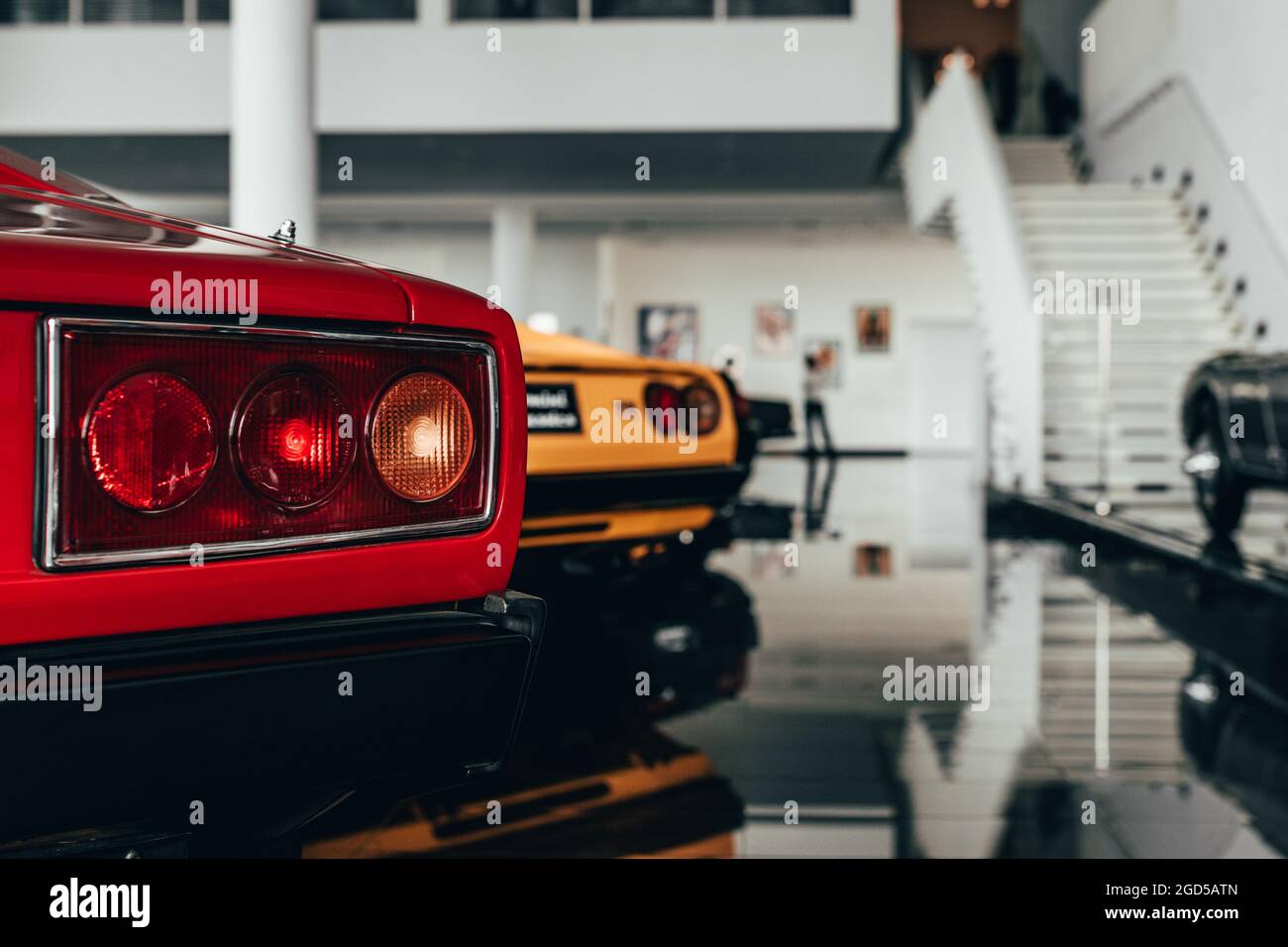 Back view of red and yellow cars Stock Photo - Alamy