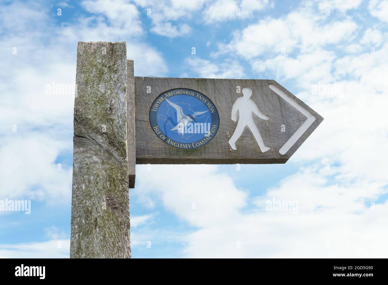 Isle of Anglesey coastal path sign in English and Welsh languages a 130 mile long walking trail around Anglesey in North Wales UK Stock Photo