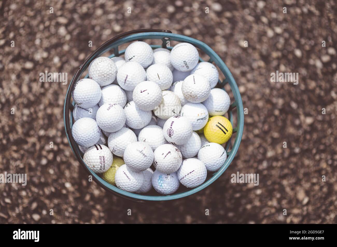 A top view of many golf balls in a 