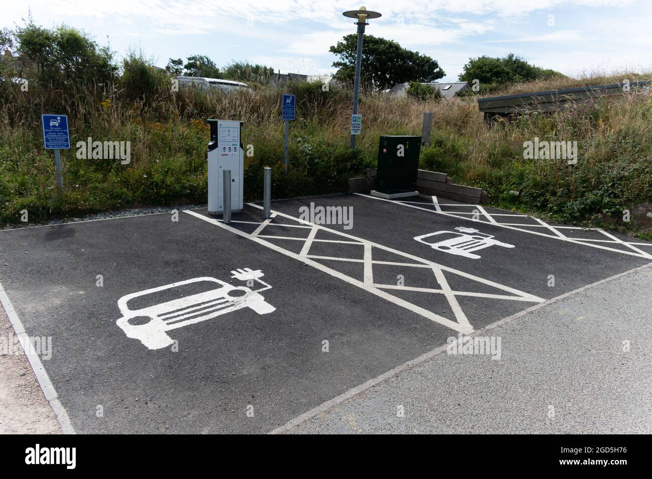 Two e-vehicle recharging points situated in the car park of Oriel y Parc Gallery & Visitor Centre, St Davids, Wales Stock Photo