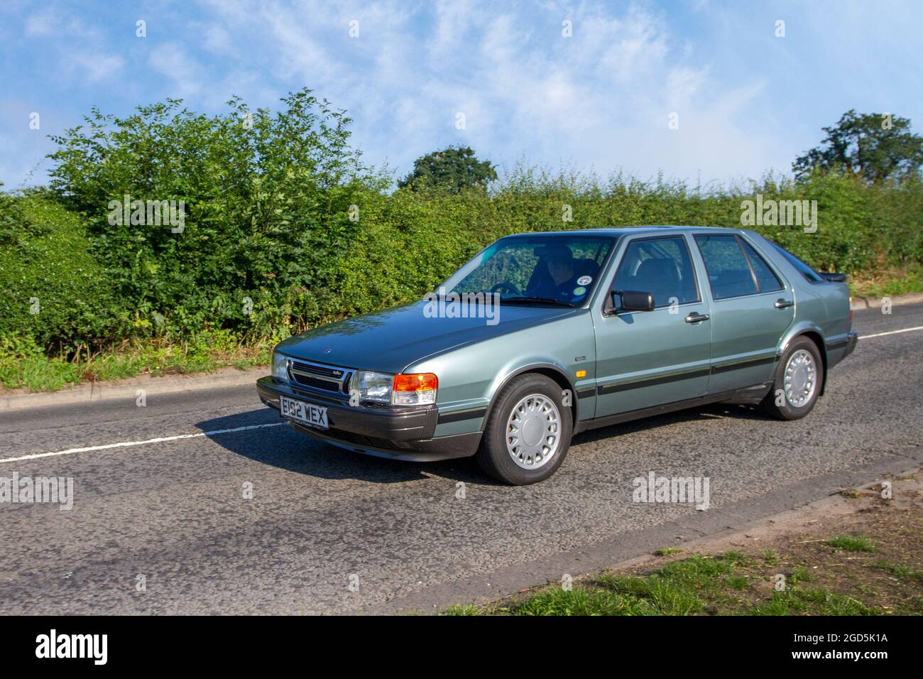 1987 80s green SAAB Turbo 1985cc 4dr saloon en-route to Capesthorne Hall classic July car show, Cheshire, UK Stock Photo