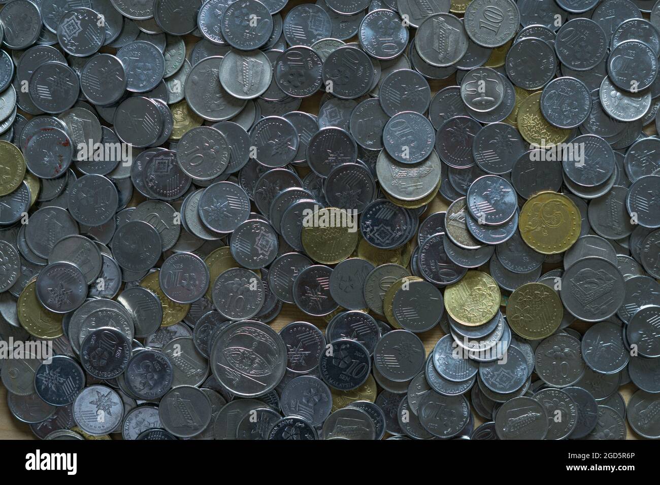 Top view of a pile of Malaysian ringgit coins of different ...