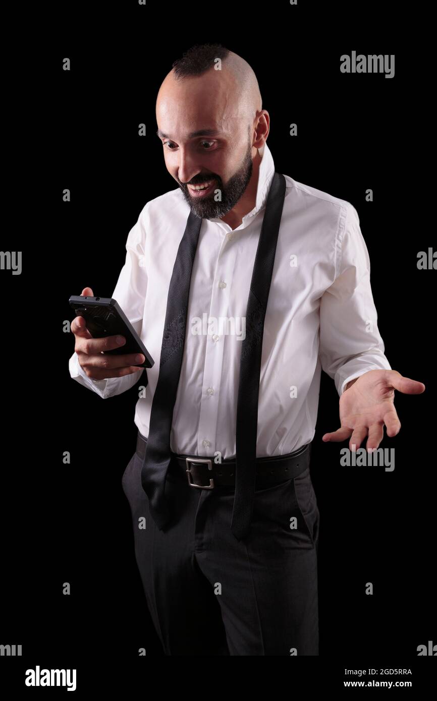 Happy hispanic man gladly surprised by good news Stock Photo