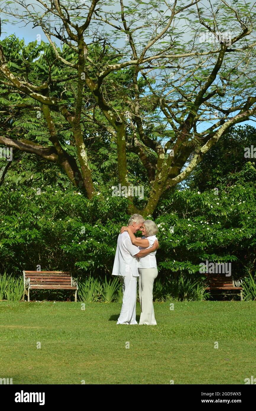 Beautiful caucasian senior couple in the park Stock Photo - Alamy