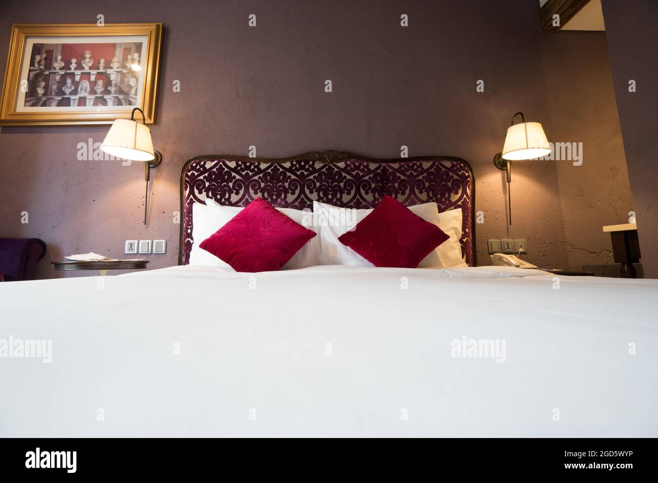 Bedroom with red cushions Stock Photo Alamy