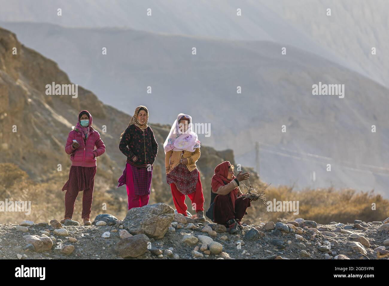 Hunza valley, Pakistan - June 2021: Wakhi women outdoor Stock Photo