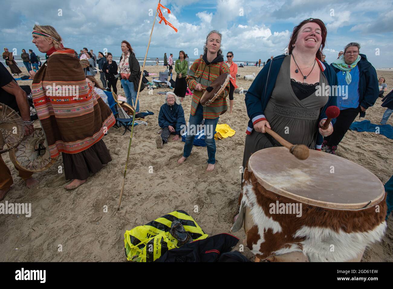Scheveningen beach, The Hague, The Netherlands. Sunday 8th August, 2021.  Hundreds of 'New-age' protesters gathered to chant, dance and beat their  drum Stock Photo - Alamy