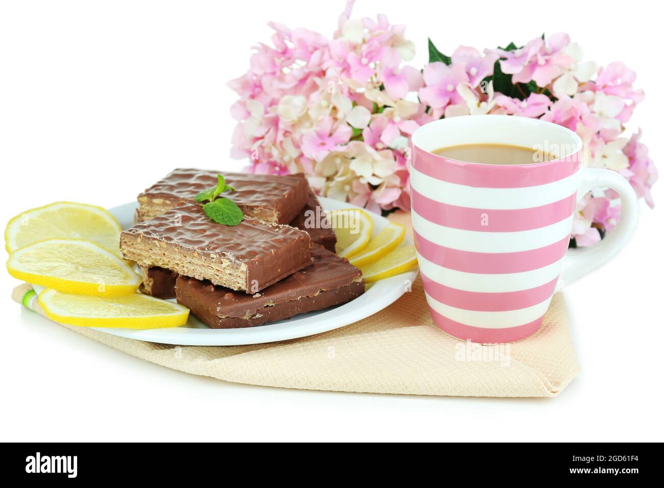 Cup of tea and sweets isolated on white Stock Photo Alamy
