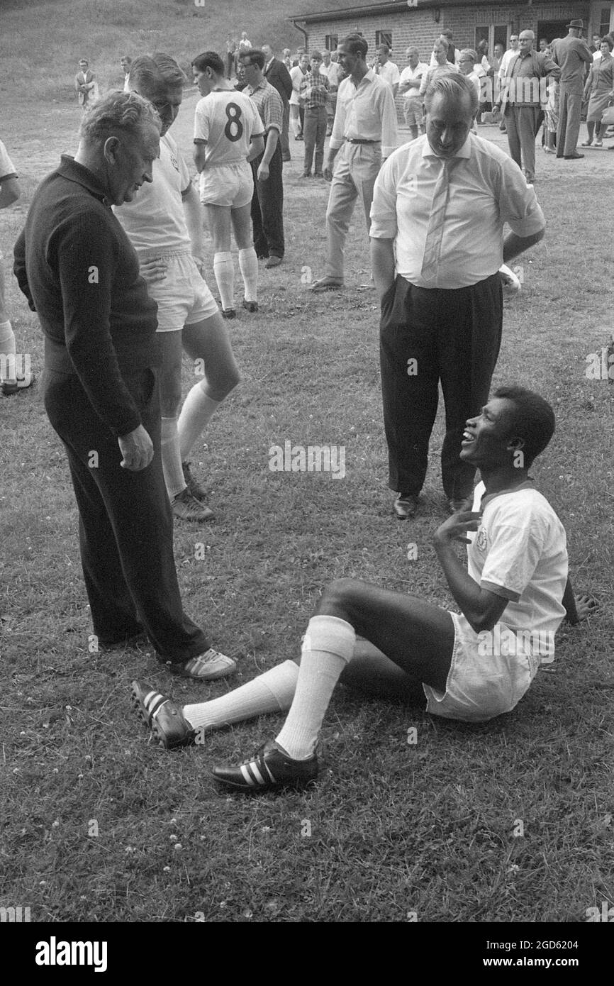 Guy ACOLATSE, right, Togo, soccer player, sits on the pitch, here in ...