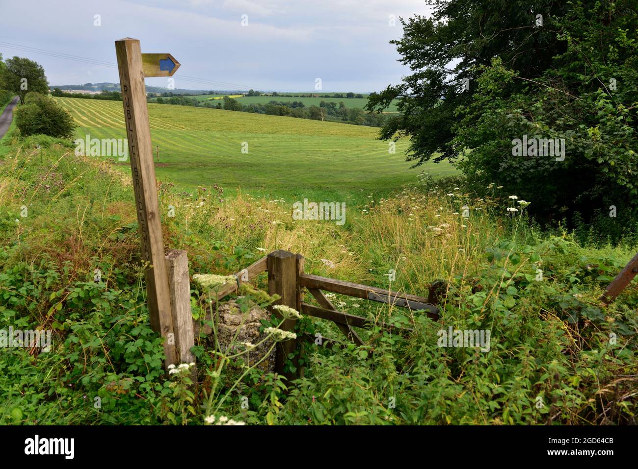 Sign post with Public Bridleway outskirts of Wells, farm gate and fields in Mendip district of Somerset, UK Stock Photo
