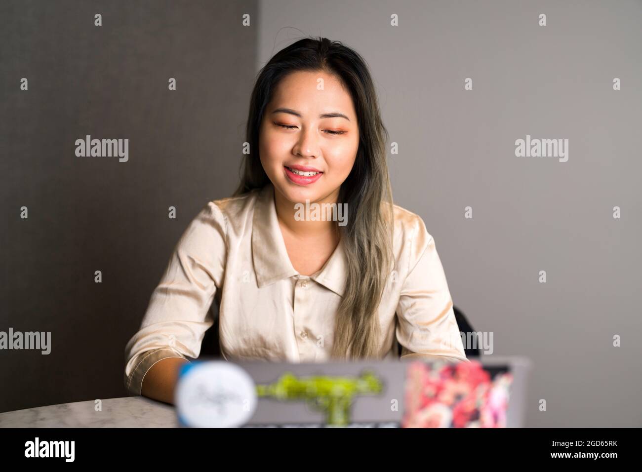 Young Edgy Asian Data Scientist on a Video Conference Stock Photo