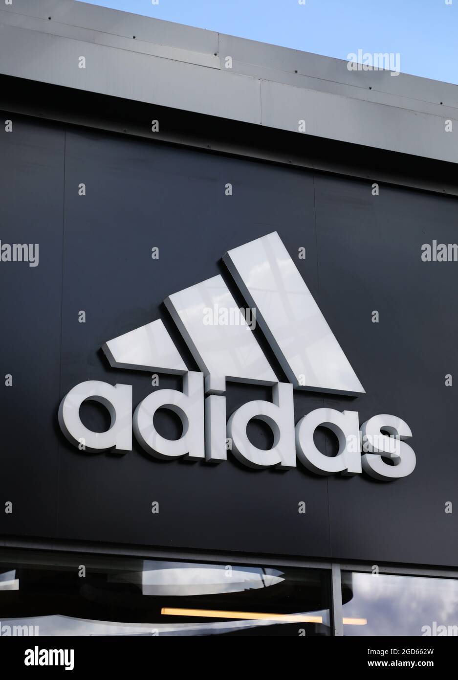 Adidas sign at Hede Fashion Outlet Stock Photo - Alamy