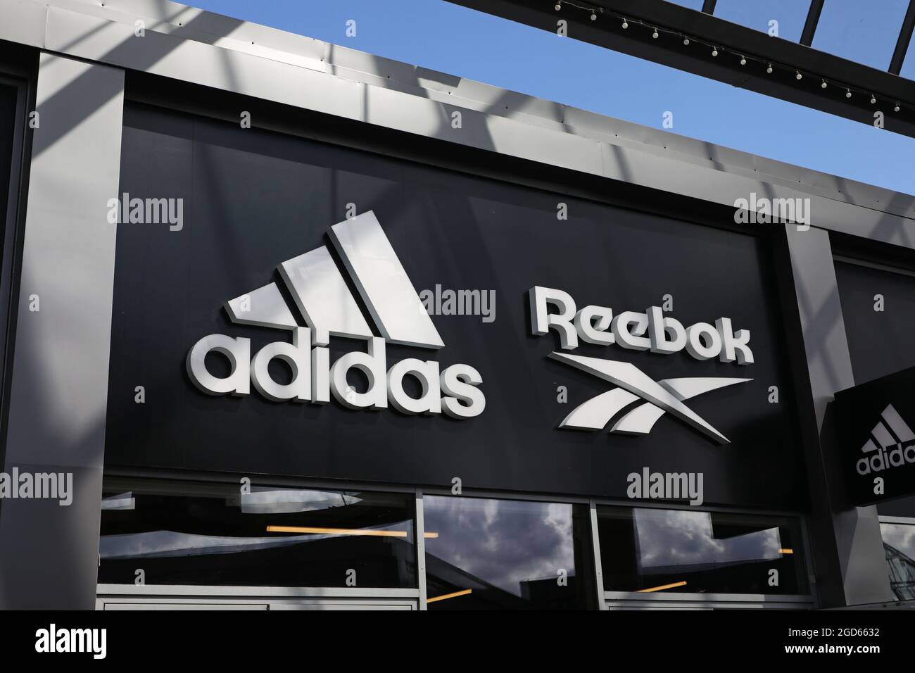 Adidas and Reebok signs at Hede Fashion Outlet Stock Photo - Alamy