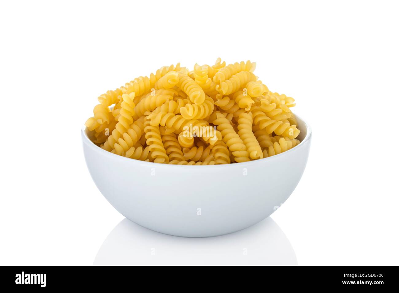 Girandole. Girandole pasta in white bowl, on white background Stock Photo