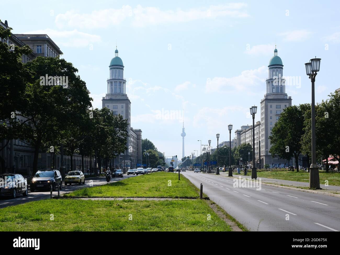 Berlin, Germany, June 17, 2021, view through Frankurter Tor towards Alexanderplatz with Karl-Marx-Allee and TV tower in the background Stock Photo
